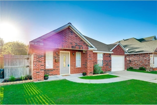 view of front of home featuring a garage and a front lawn