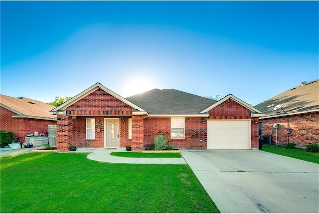 view of front of house with a garage and a front lawn