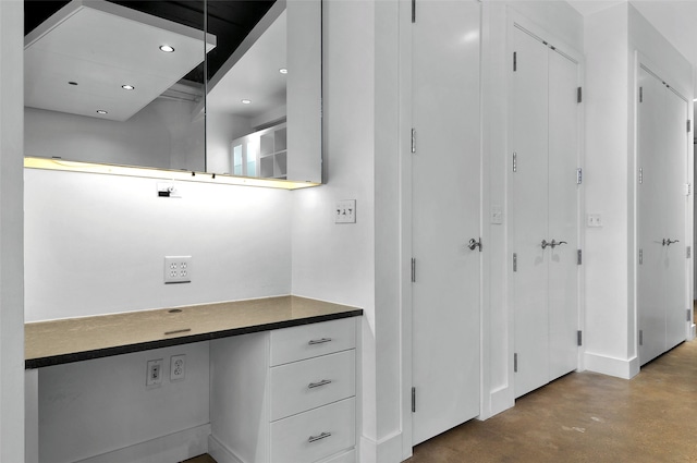 bathroom with concrete floors