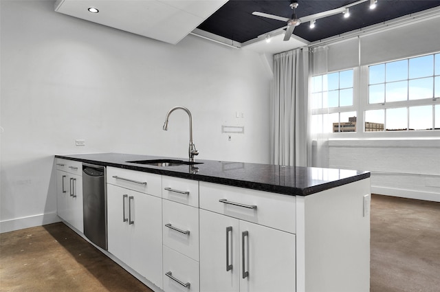 kitchen featuring white cabinets, ceiling fan, and sink