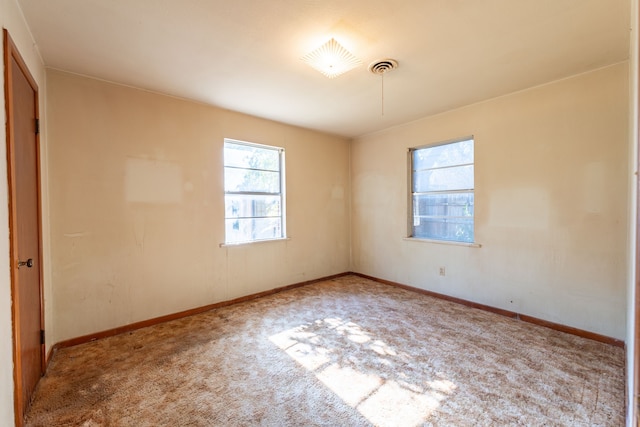 unfurnished room featuring carpet floors