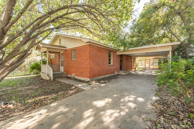 view of front of home with a carport