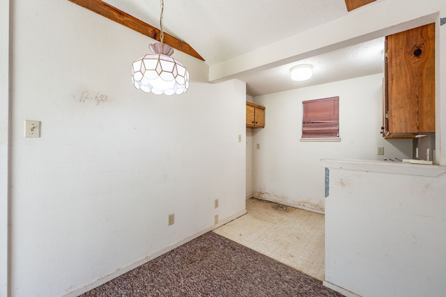 laundry room featuring a textured ceiling