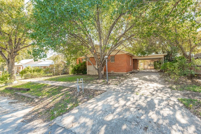 view of front of home featuring a carport