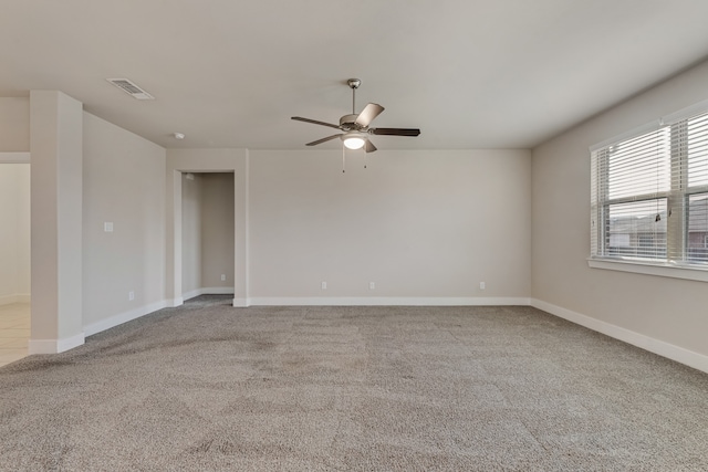 carpeted empty room featuring ceiling fan