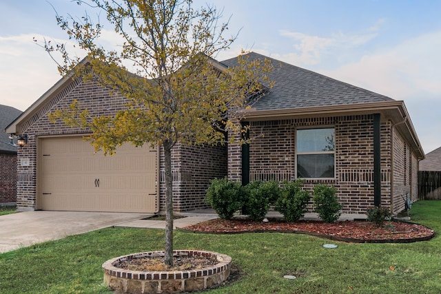 view of front of house with a front lawn and a garage