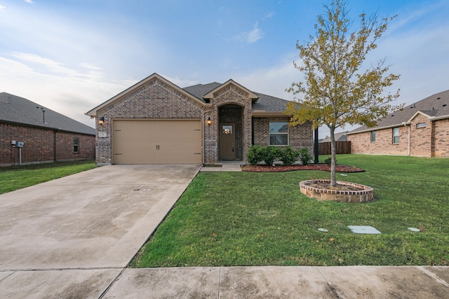 view of front of home with a garage and a front yard