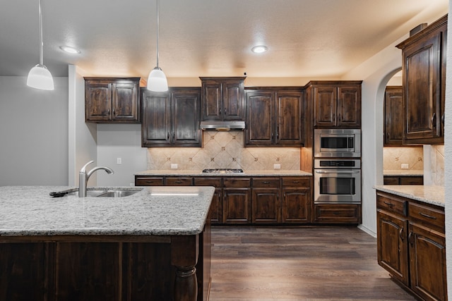 2216 Rosalinda Pass, Fort Worth, TX 76131 - kitchen featuring stainless steel appliances, a sink, under cabinet range hood, dark brown cabinetry, and recessed lighting