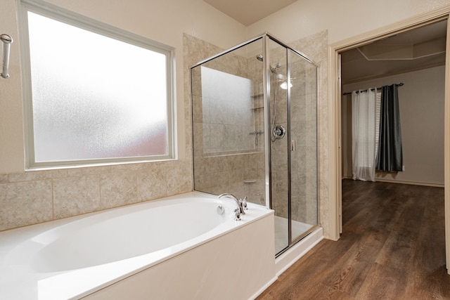 bathroom with hardwood / wood-style floors and plus walk in shower