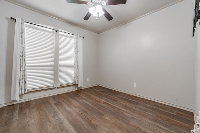 empty room with ceiling fan, dark hardwood / wood-style floors, and crown molding