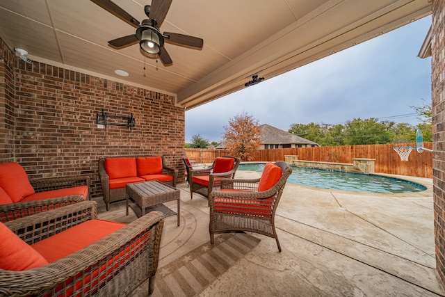 view of patio / terrace featuring an outdoor living space, pool water feature, a fenced in pool, and ceiling fan