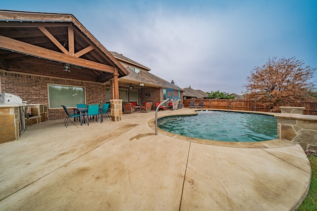 view of swimming pool with a patio area