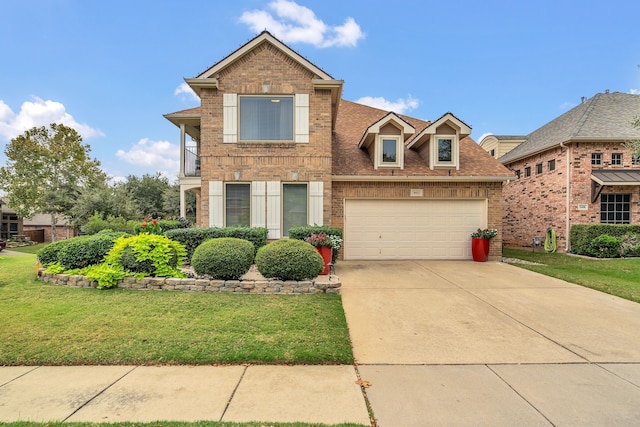 view of front of home featuring a garage and a front lawn