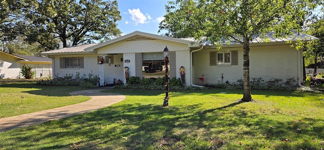 ranch-style house with a front lawn