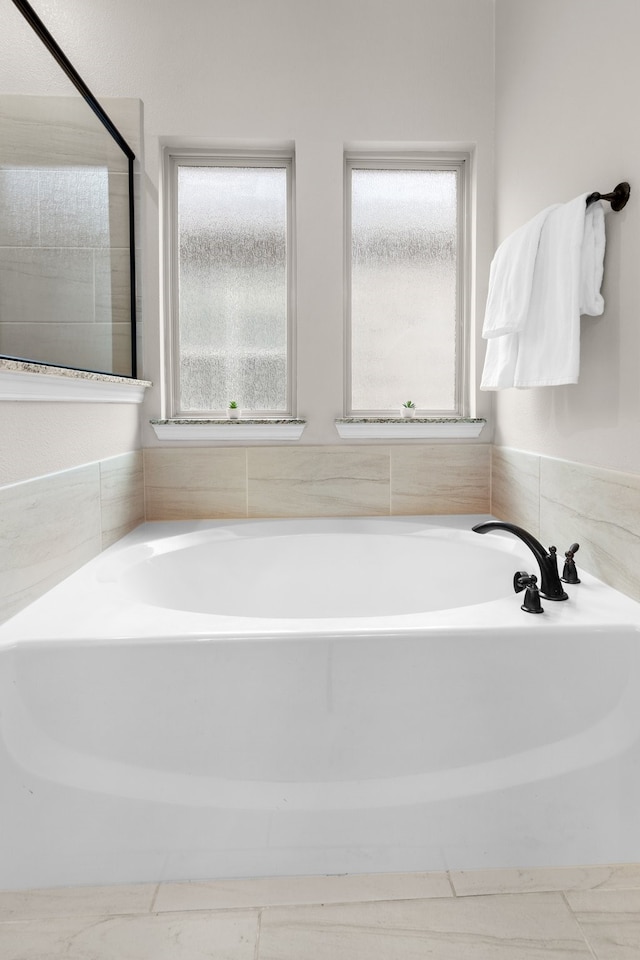 bathroom featuring a tub