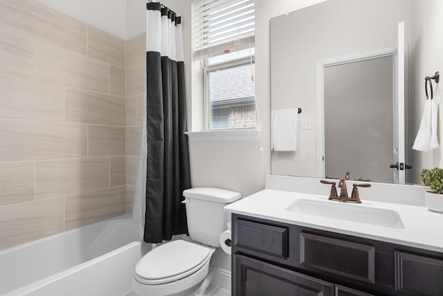 full bathroom featuring toilet, shower / tub combo with curtain, vanity, and a healthy amount of sunlight