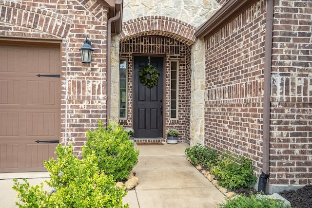 property entrance with a garage