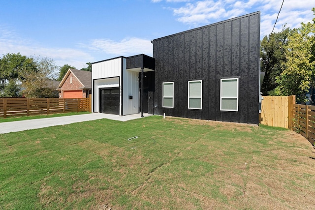 contemporary home with a front lawn