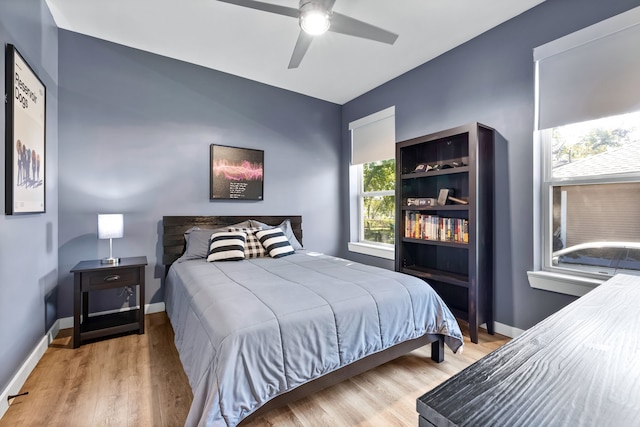 bedroom featuring hardwood / wood-style floors and ceiling fan