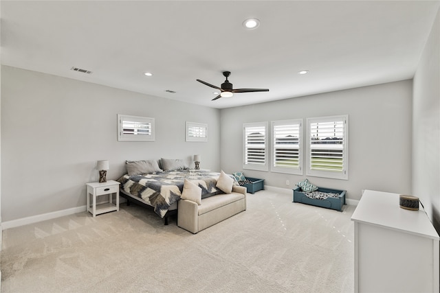 bedroom with light carpet and ceiling fan