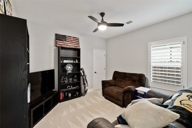 living room with carpet and ceiling fan