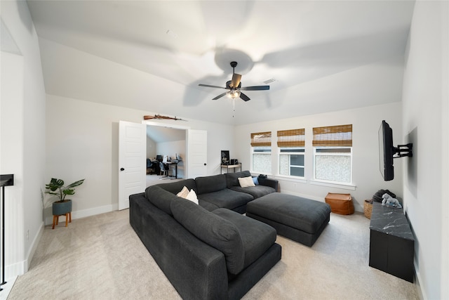 living room featuring light carpet and ceiling fan