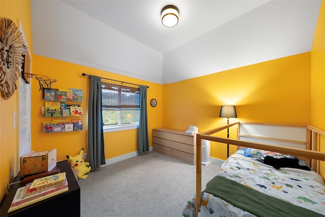 carpeted bedroom featuring lofted ceiling