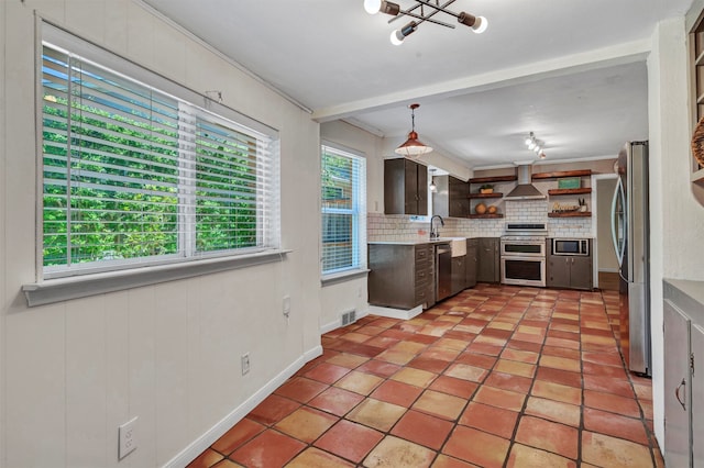 kitchen with stainless steel appliances, wall chimney exhaust hood, backsplash, crown molding, and pendant lighting