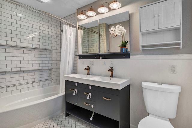 full bathroom featuring toilet, shower / bath combo, vanity, and tile patterned flooring