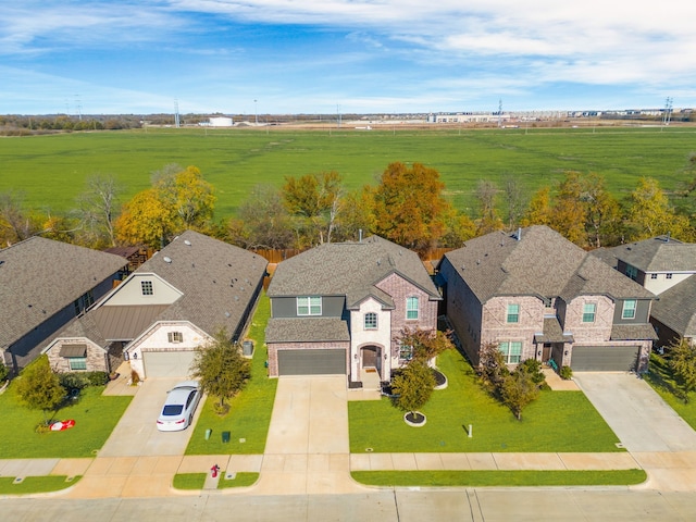 birds eye view of property with a rural view