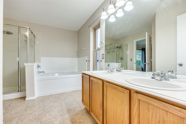 bathroom featuring tile patterned flooring, plenty of natural light, shower with separate bathtub, and vanity