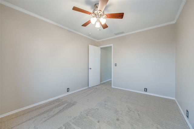 unfurnished room featuring light carpet, crown molding, and ceiling fan