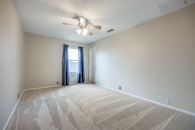 empty room with light carpet and ceiling fan