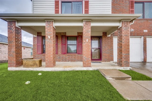 property entrance with a lawn