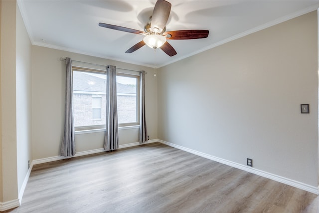 empty room featuring ornamental molding, light hardwood / wood-style floors, and ceiling fan