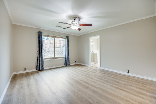 spare room featuring ornamental molding, light hardwood / wood-style floors, and ceiling fan