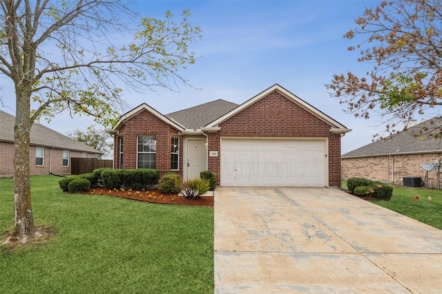 view of front of property with a garage, central air condition unit, and a front yard