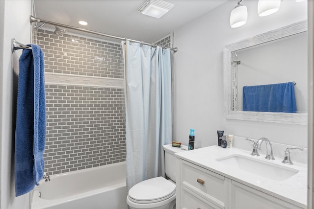 full bathroom with toilet, vanity, and shower / bath combo with shower curtain