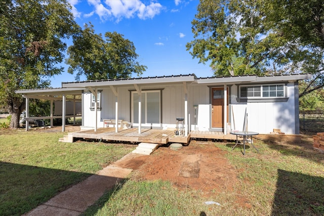 exterior space with a front lawn and a deck