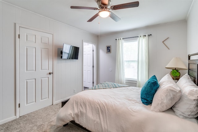 bedroom featuring ceiling fan, carpet flooring, and ornamental molding