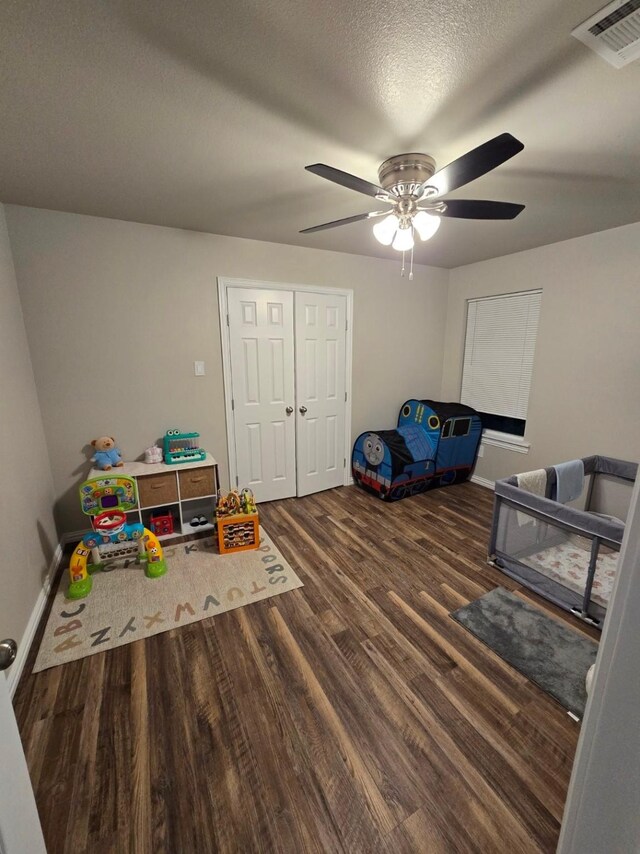 unfurnished living room featuring ceiling fan, sink, and dark hardwood / wood-style flooring