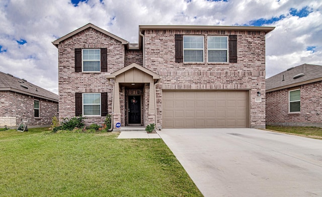 view of front of property with a front yard and a garage