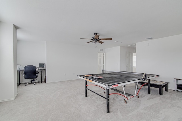 recreation room featuring light colored carpet and ceiling fan