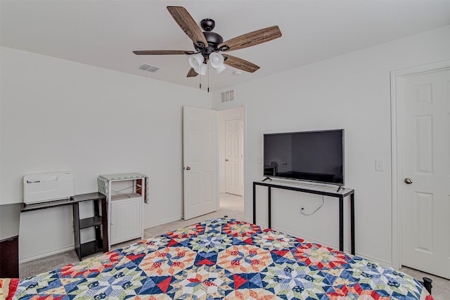 bedroom with ceiling fan and light carpet