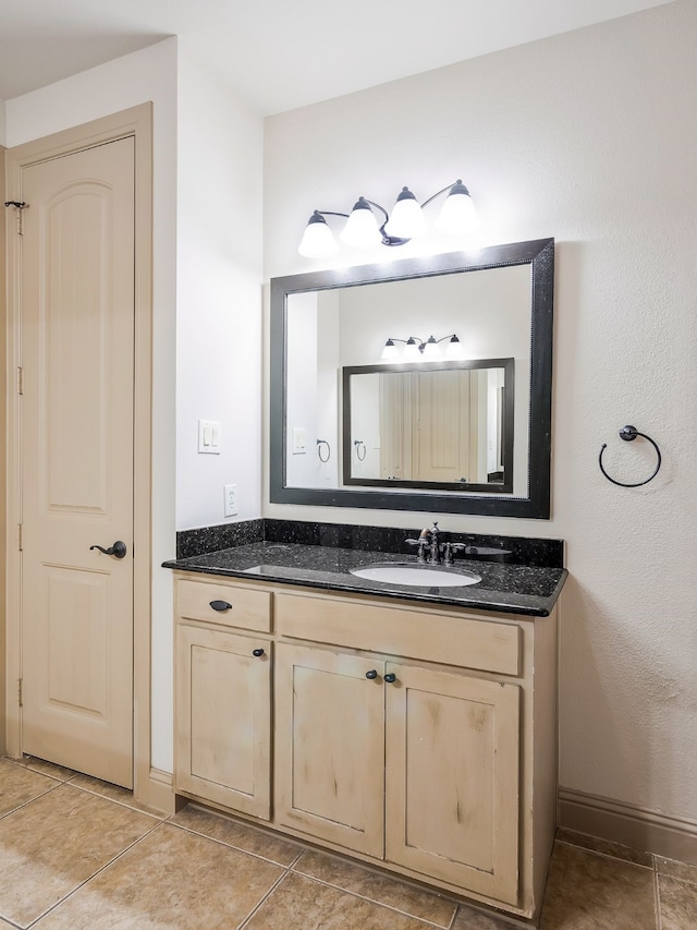 bathroom with vanity and tile patterned flooring