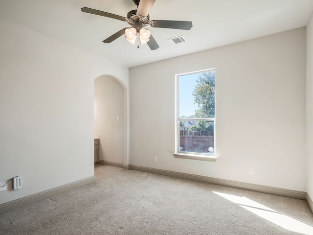 carpeted empty room with ceiling fan