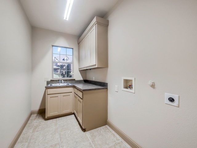 clothes washing area featuring hookup for an electric dryer, cabinets, sink, light tile patterned floors, and hookup for a washing machine