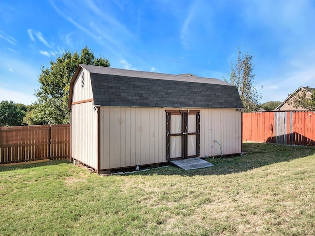 view of outdoor structure featuring a lawn