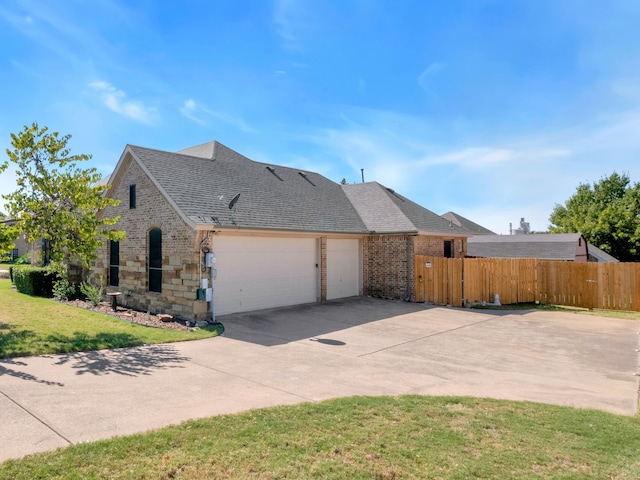 view of home's exterior with a garage and a yard