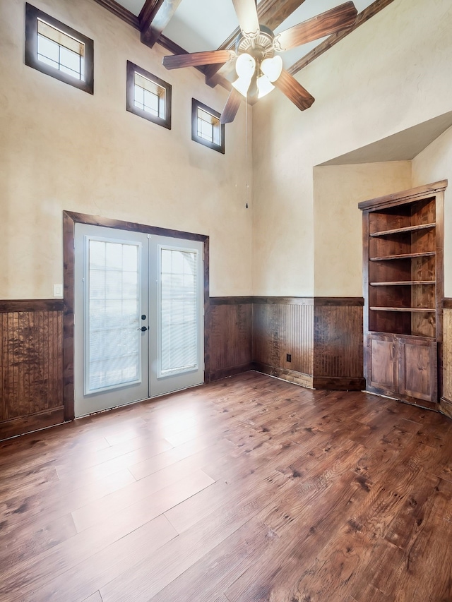 interior space featuring hardwood / wood-style flooring, beam ceiling, and french doors